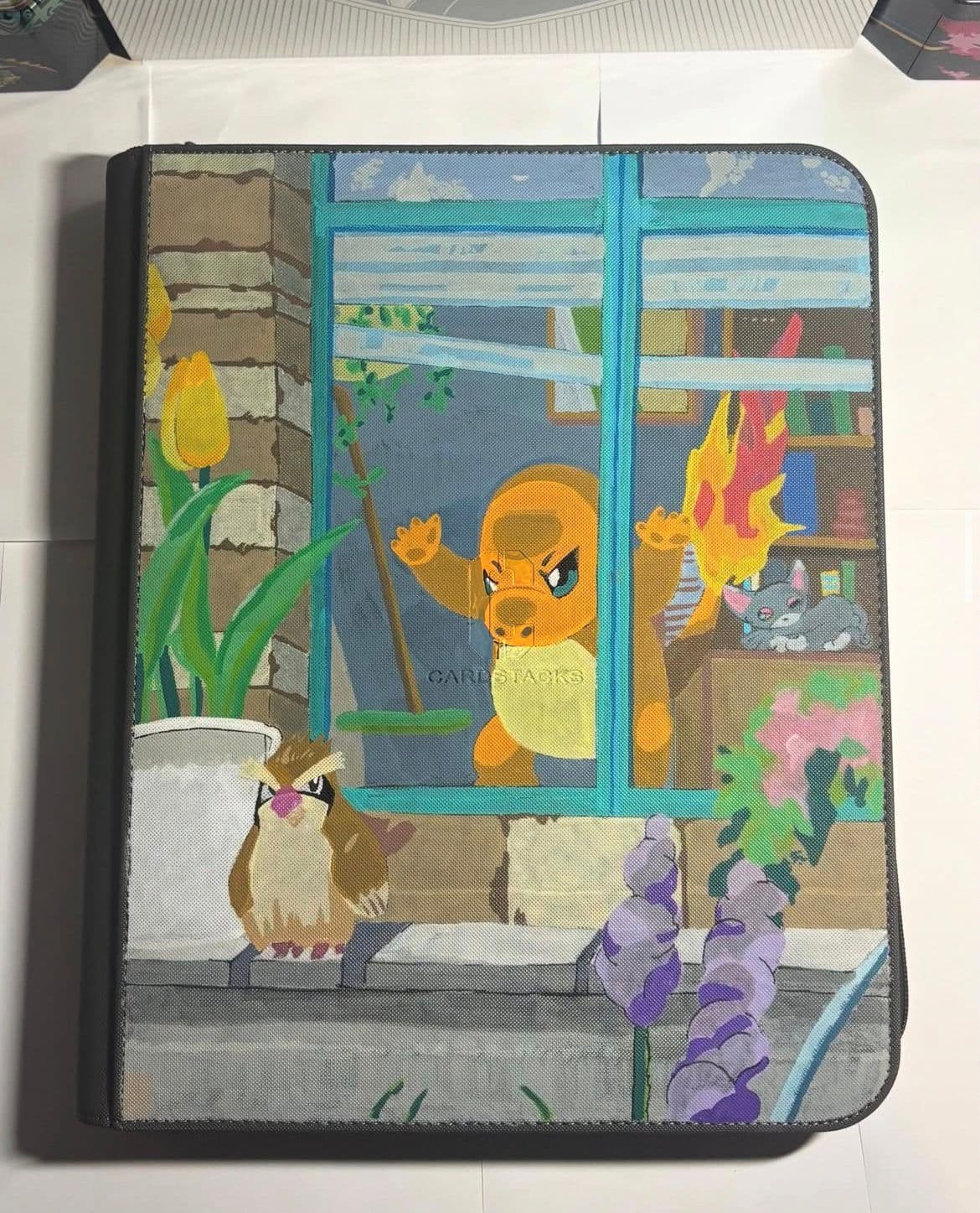 Custom Charmander binder with a cosy window scene