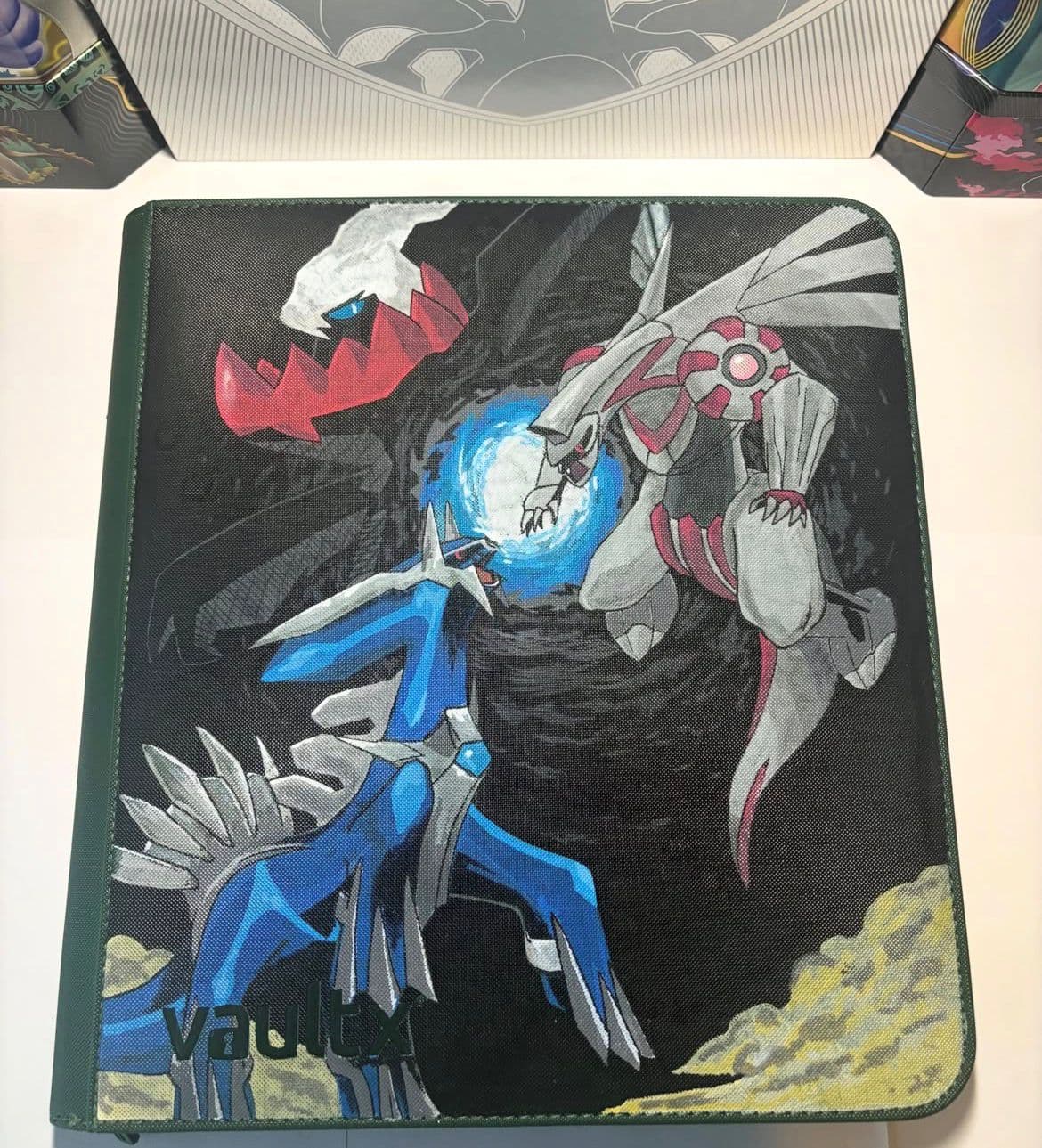 Custom binder with Dialga, Palkia and Darkrai in a legendary battle scene